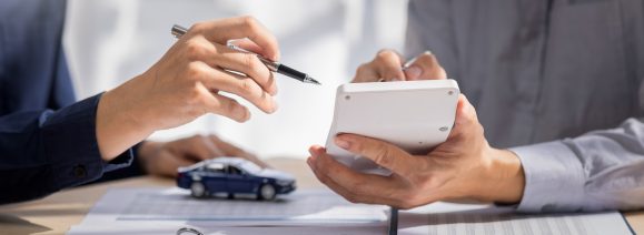 Car Insurance document or lease concept the car broker assisting his customer and explaining the