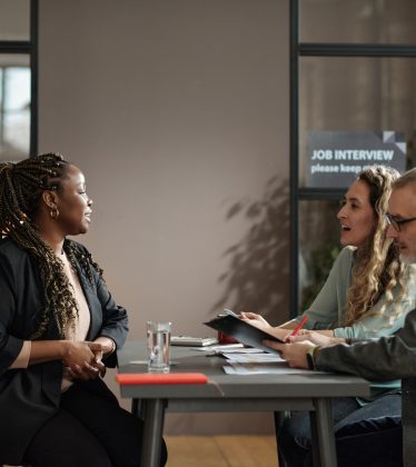 Woman talking about her qualification at job interview